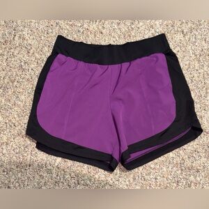 Women’s size large Tek Gear Women's Athletic Shorts - Purple and Black